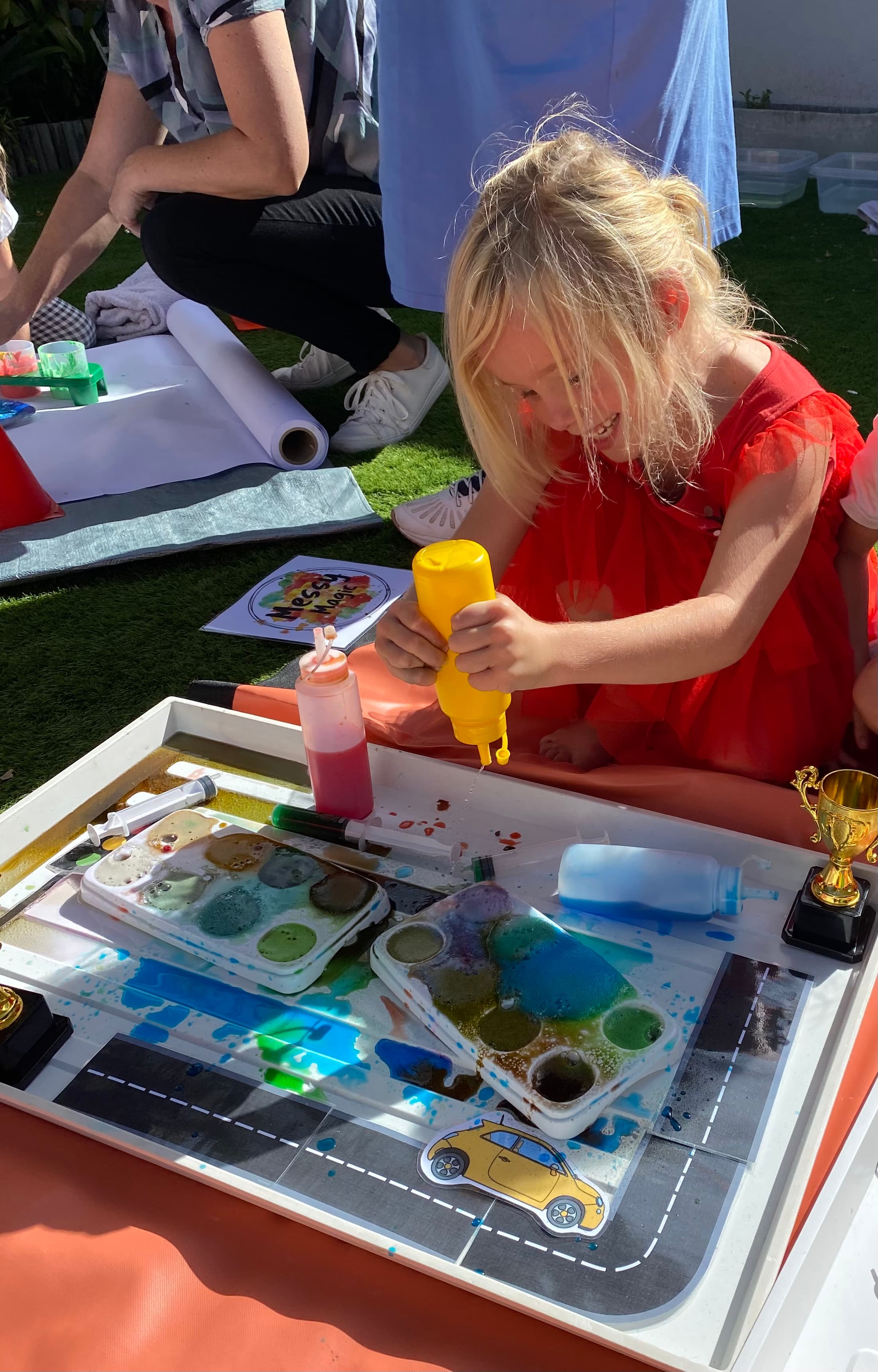 A girl having fun at a party hosted by Messy Magic